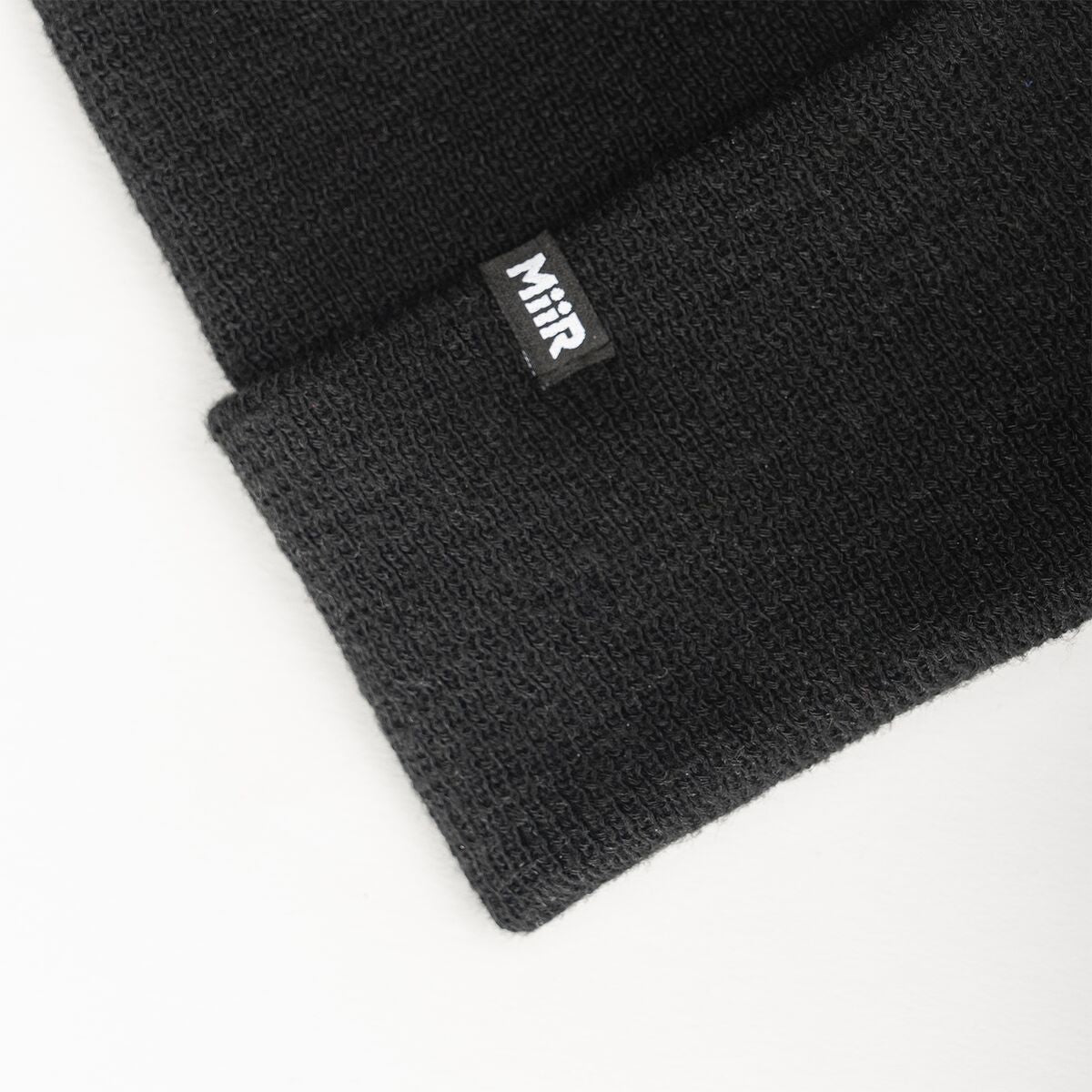 recycled-poly-fine-knit-beanie-z4 WebPDP-RecycledPolyFineKnitBeanie_Studio_TagDetail_Black__BNE005002OS.jpg